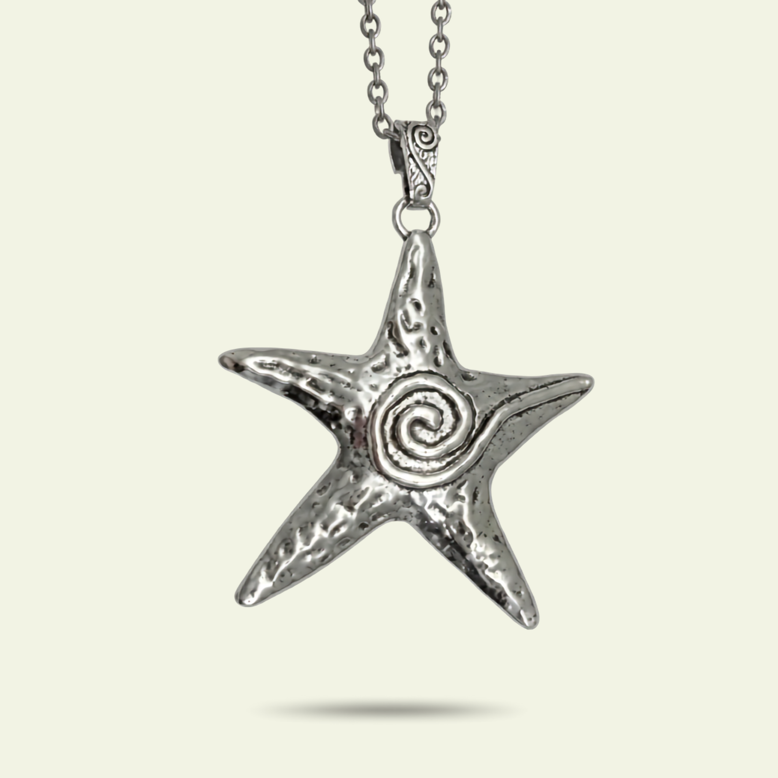 Silver star-shaped pendant with a spiral design on a white background