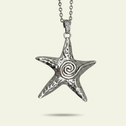 Silver star-shaped pendant with a spiral design on a white background