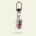 Keychain with a can-shaped charm on a white background