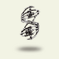 Silver spiral ring with black gemstones on a light beige background