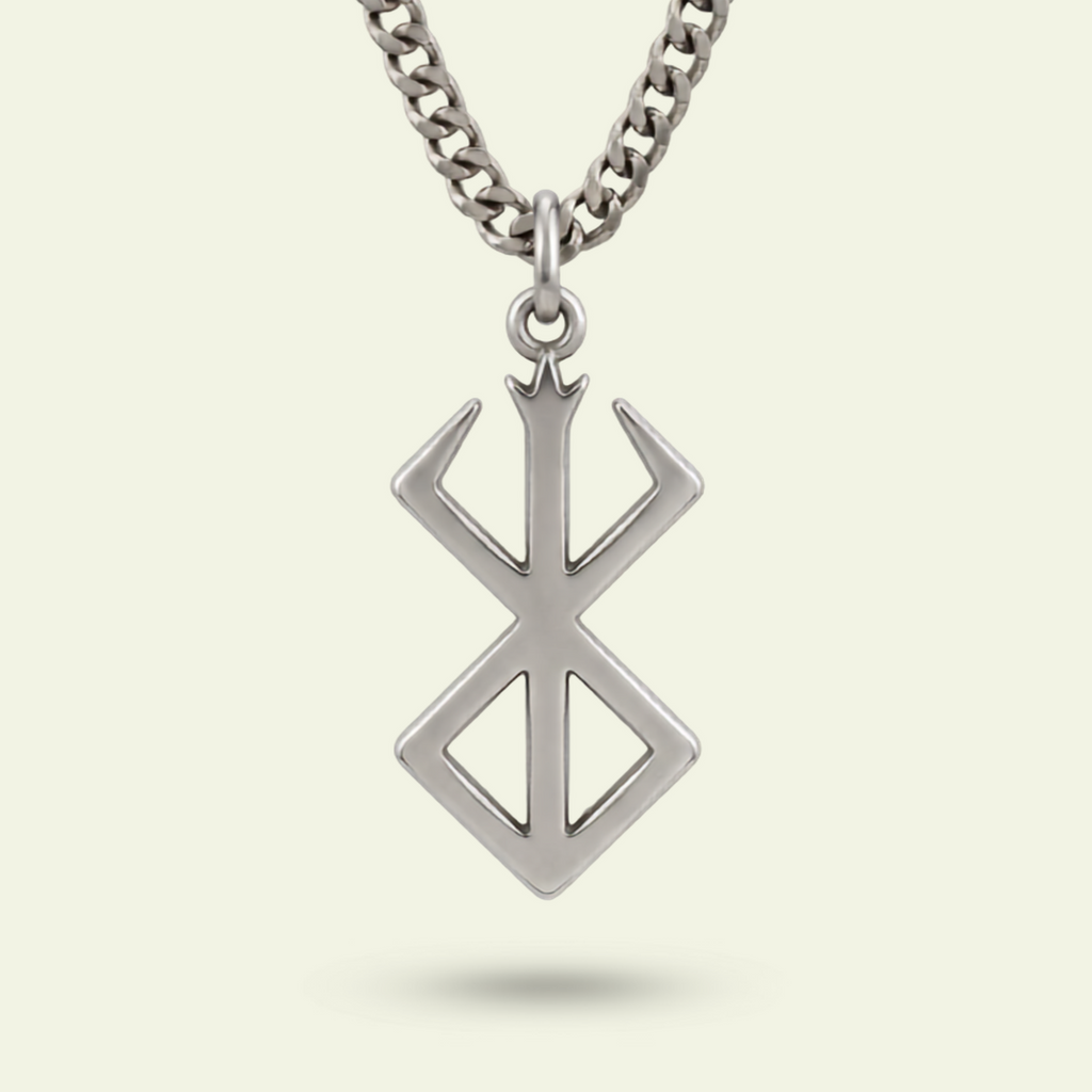 Silver necklace with a geometric pendant on a light gray background