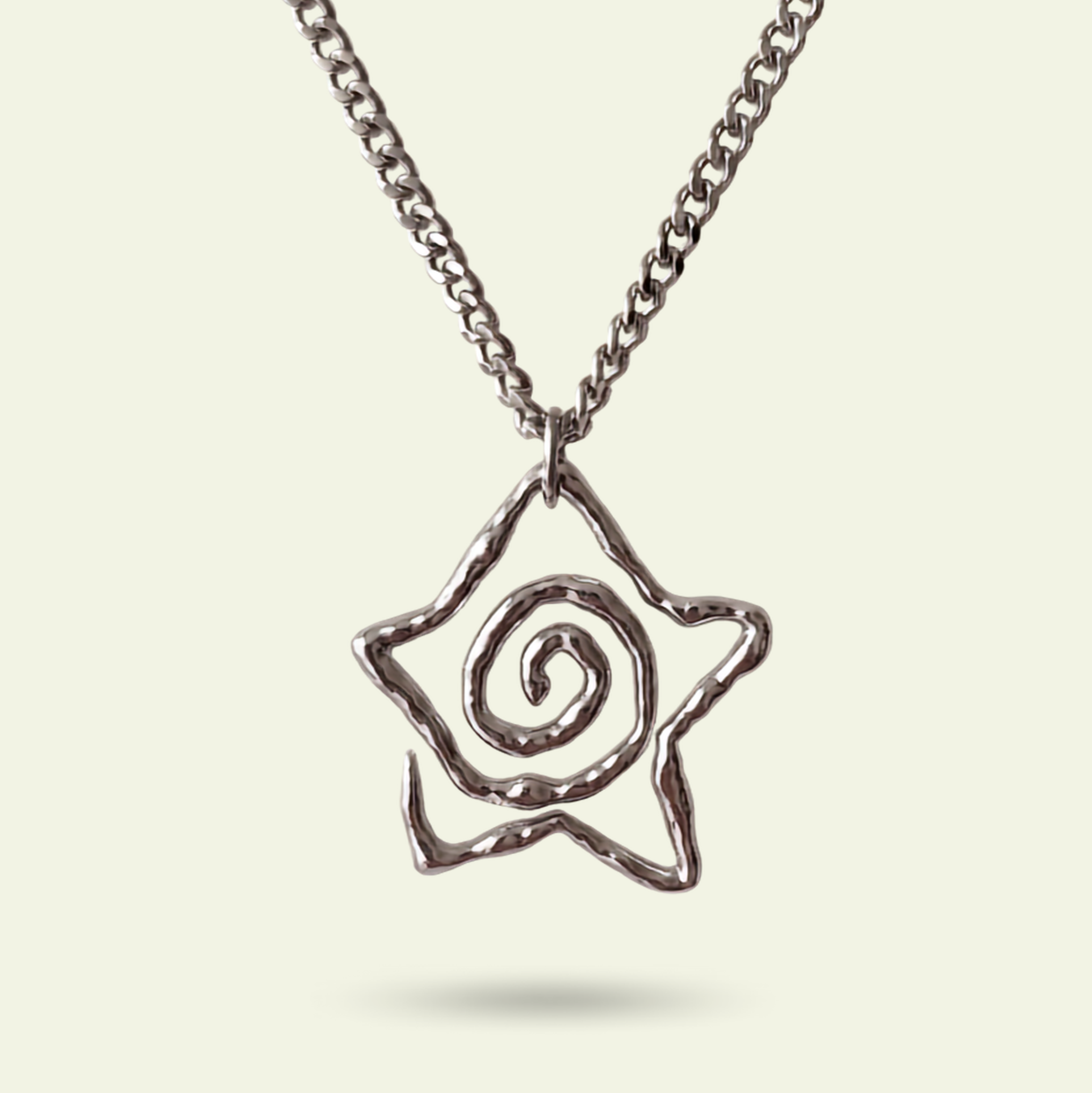 Silver necklace with a spiral pendant on a light beige background